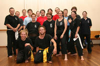Tara and Calvin - front - are joined by the Seniors after their grading