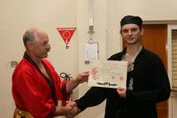 Master Hardy presents Sifu Bellchambers with his 3rd Higher Level certificate