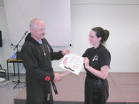 Fire Dragon's newest Sudent Instructor - Wasu Ingrid Bean, who is also known as Little Leopard, receiving her certificate from Master Hardy.