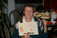 Jayne Hardy with her Provisional Black Belt certificate