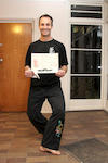 Andrew, with sash and certificate