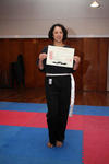Anita, showing her White Sash certificate, and wearing her rank sash! Well done!