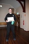 Justin, with certificate and his new green sash.